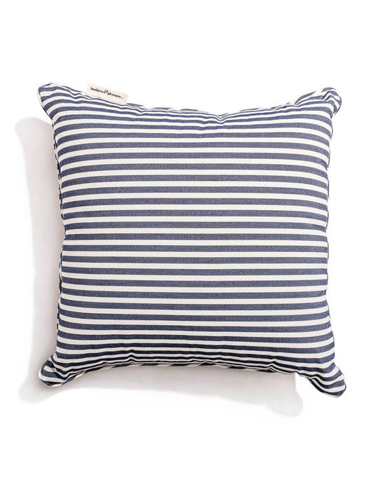 The Laurens Navy Stripe Small Square Throw Pillow by Business & Pleasure Co features blue and white horizontal stripes made from UV-durable Pleasuretex fabric. It has a small tag on the top left corner, perfect for indoor and outdoor comfort.