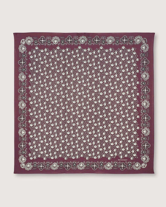 The Moismont Bandana No 675 in Plum, crafted from cotton and showcasing a screen-printed white paisley pattern with a decorative border, is displayed flat on a plain background.