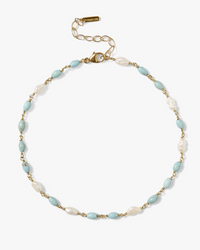 Chan Luu Gold and turquoise beaded CL Anklet in Turquoise Mix with lion's paw shell accents on a white background.