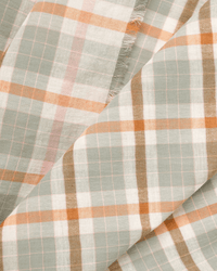 Close-up of a Moismont Plaid Bandana in Cloud, reminiscent of an oversized scarf, featuring intersecting vertical and horizontal lines in muted shades of green, orange, and white.