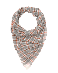 The Plaid Bandana in Cloud by Moismont boasts a gray and white plaid design with vibrant orange accents, elegantly fashioned into a triangular shape.