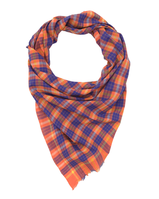 The Plaid Bandana in Poppy Red by Moismont, featuring vibrant patterns of orange and blue, is displayed in a triangular shape on a white background.