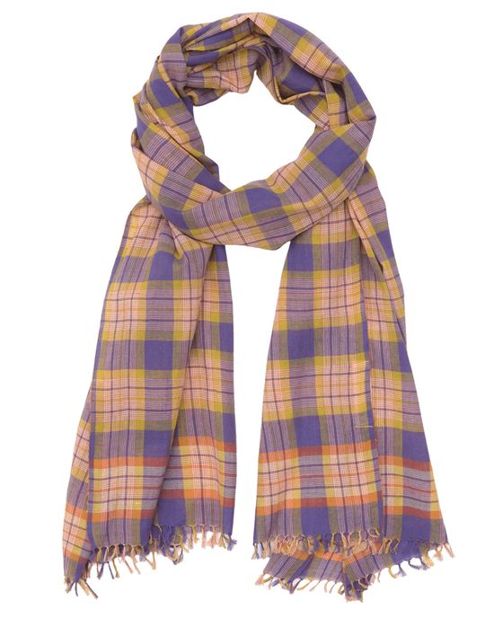 This Moismont creation, the Varied Plaid Scarf in Pansy Blue, is a beautifully designed cotton scarf featuring purple and yellow plaid patterns with elegant fringed edges, stylishly arranged in a loop.