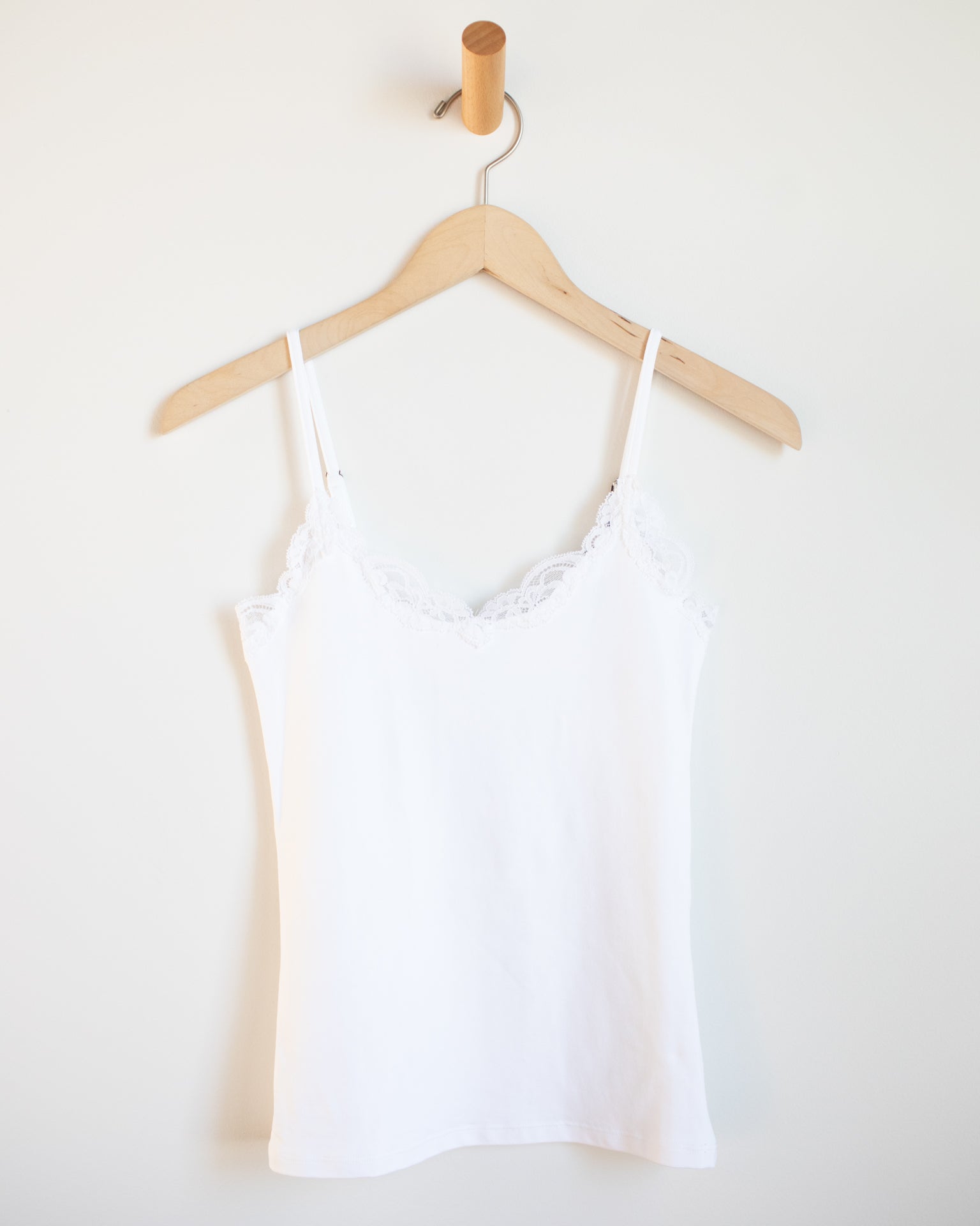 https://www.blissboutiques.com/cdn/shop/products/bliss-bouqitues-only-hearts-del-w-lace-v-cami-in-white-30094854193249.jpg?v=1661982357